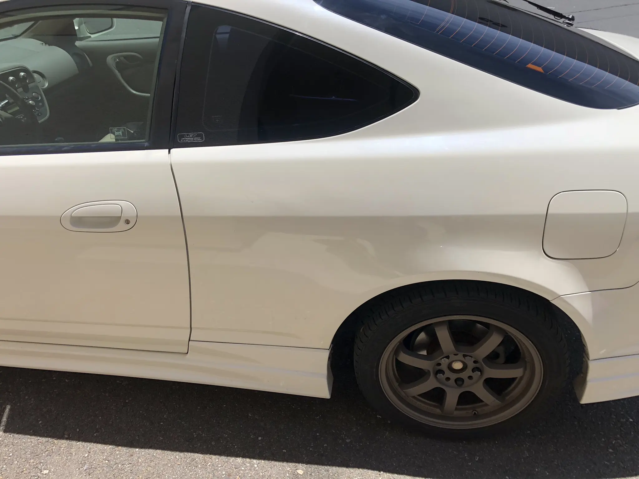 Panel after paintless dent repair on an Acura